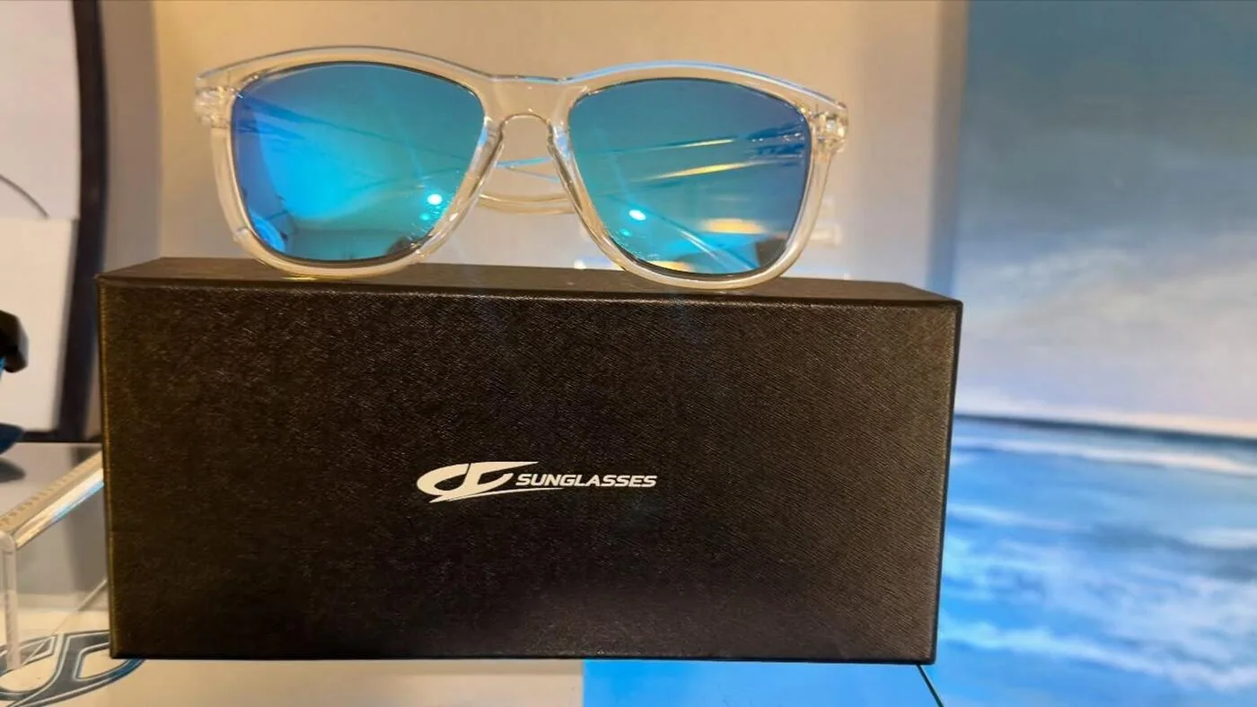 JC Signature sunglasses on branded box